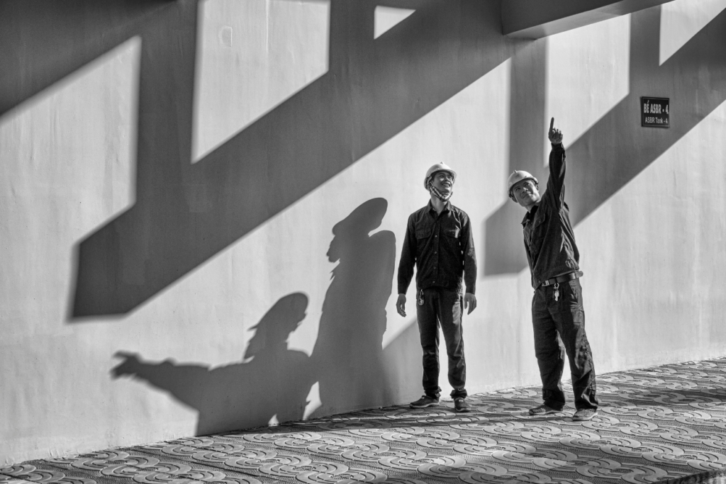 Silhouetted Engineers Inspecting Construction Site