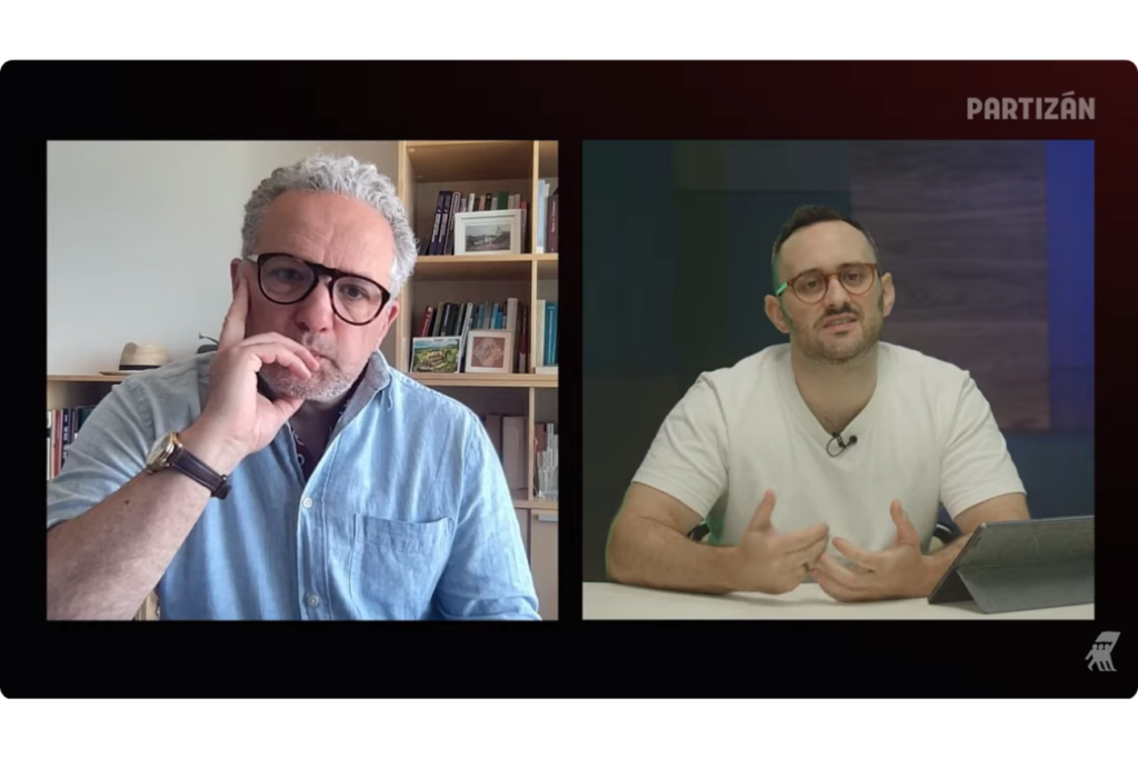 screengrab from the video, with Cornel Ban on the left and the reporter on the right (online interview)